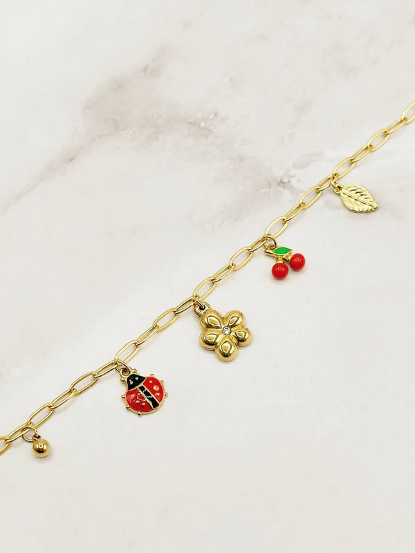 Bracelet with red charms, Gold